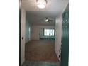 Bright and spacious entryway with carpeted floors at 32525 Oak Park Dr, Leesburg, FL 34748