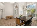 Elegant dining room with hardwood floors and a large window at 858 Creston Dr, Maitland, FL 32751