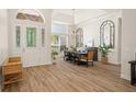 Bright dining room features a large table, chandelier, and hardwood floors at 858 Creston Dr, Maitland, FL 32751