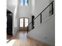Bright and airy entryway with hardwood floors and modern staircase at 4508 Packard S Ave, St Cloud, FL 34772