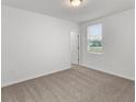 Spacious bedroom with carpeted floor and a window with blinds at 2130 Judith Ct, Haines City, FL 33844