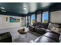 Game room featuring a leather sectional sofa and dark blue ceiling with stars at 2874 Stanza Ct, Kissimmee, FL 34746