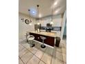 Spacious kitchen with island, granite countertops, and white cabinets at 2442 Tangier Dr, Kissimmee, FL 34747