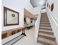 Bright and airy entryway with a staircase leading to the second floor at 8914 Zurich Ln, Kissimmee, FL 34747