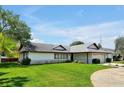 House exterior on sunny day with lush green lawn at 1333 Clayton Dr, Deltona, FL 32725