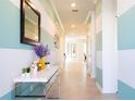 Bright entryway with a stylish console table at 4326 Scene Ln, Kissimmee, FL 34746