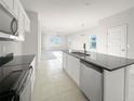 Kitchen with island and dark countertops at 3744 Sagefield Dr, St Cloud, FL 34773