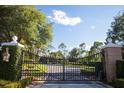 Ornate entrance gate to a private community at 11027 Cromwell Rd, Orlando, FL 32827