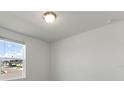 Simple bedroom with a window and neutral walls at 1167 Foreshore Ln, Haines City, FL 33844
