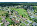 An aerial view showcasing the home's location within a community near a golf course at 2172 Nw 50Th Cir, Ocala, FL 34482