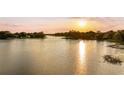 Peaceful lake view at sunset, showcasing waterfront property at 1305 W Lake Mary Blvd, Lake Mary, FL 32746