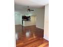 Open living space with hardwood floors and kitchen view at 5132 Conroy Rd # 937, Orlando, FL 32811