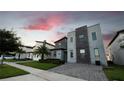 Modern home with stone accents in a row of similar houses at 2965 Fable St, Kissimmee, FL 34746