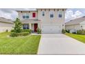 Two-story house with a two-car garage at 418 Anne St, Deland, FL 32724