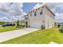 Two-story house with a two-car garage at 418 Anne St, Deland, FL 32724