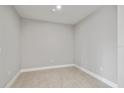 Empty spare room with gray walls and carpet at 7557 Laureate Blvd # 6208, Orlando, FL 32827
