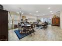 Bright dining room featuring a spacious table and hardwood floors at 875 Fillmore Ct, Davenport, FL 33837