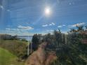 Lake view from condo; sunny day with blue skies at 3446 Soho St # 304, Orlando, FL 32835