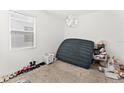 Simple bedroom with window, air mattress, and closet space at 3846 Cabo Rojo Dr, Saint Cloud, FL 34772