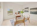 Bright home office with two chairs and a work desk at 6368 Chorus Dr, Mascotte, FL 34753