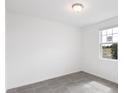 Bright bedroom with gray tile floors and a large window at 3518 Rutland Ln, Haines City, FL 33844