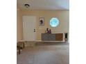 Inviting entryway with a console table and neutral color scheme at 1124 Chateau Cir, Minneola, FL 34715