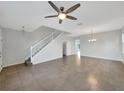 Open living and dining area with a neutral color scheme and tile floors at 3557 Julius Estates Blvd, Winter Haven, FL 33881