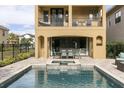 Private pool and spa with patio furniture and outdoor dining at 860 Desert Mountain Ct, Reunion, FL 34747
