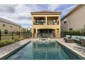 Private pool and spa with patio furniture and outdoor dining at 860 Desert Mountain Ct, Reunion, FL 34747