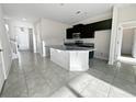 Modern kitchen with dark cabinets and granite countertops at 3690 Sagefield Dr, St Cloud, FL 34773