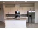 Modern kitchen with stainless steel appliances and an island at 2333 Datura Loop, St Cloud, FL 34772