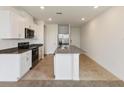 Modern kitchen with stainless steel appliances at 1357 Current Pl, Haines City, FL 33844