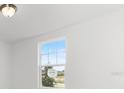 Bright bedroom with carpet flooring and a large window at 2466 Leeds St, Haines City, FL 33844
