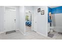 Bright entryway with tile flooring, leading to bedroom and bathroom at 4021 Silverstream Ter, Sanford, FL 32771