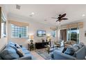 Spacious living room with two sofas and a TV at 7576 Excitement Dr, Reunion, FL 34747