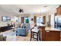 Open living area with kitchen and seating at 7576 Excitement Dr, Reunion, FL 34747