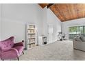 Living room with vaulted ceilings, wood beams, and comfy seating at 200 Maitland Ave # 20, Altamonte Springs, FL 32701