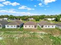 Aerial view of three houses at 524 Ellie Ct, Apopka, FL 32703