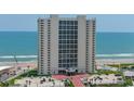Oceanfront high rise building with parking and pool visible from above at 2545 S Atlantic Ave # 2107-2108, Daytona Beach Shores, FL 32118