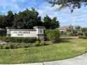 Lake Preserve Park entrance with landscaping and playground in background at 14154 Dove Hollow Dr, Orlando, FL 32824