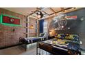 Harry Potter themed bedroom with twin beds, Hogwarts house bedding, and mural at 2726 Oxymoron Way, Kissimmee, FL 34746