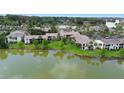 Waterfront community with multiple condo buildings and lush landscaping at 200 Maitland Ave # 174, Altamonte Springs, FL 32701