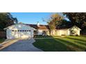 White home with two car garage and large yard at 1030 Gregory Dr, Maitland, FL 32751