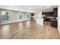 Open living room and kitchen with tile floors and plenty of natural light at 7574 Marker Ave, Kissimmee, FL 34747