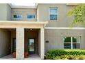 Modern townhome exterior with landscaped front at 404 Ocean Course Ave, Davenport, FL 33896