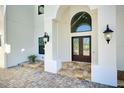 Elegant entryway with double doors and stone flooring at 2490 Zuni Rd, St Cloud, FL 34771