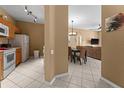 Open kitchen and dining area with modern appliances at 8101 Coconut Palm Way # 203, Kissimmee, FL 34747