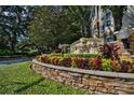 Stonebridge Place entrance with landscaping at 6214 Stevenson Dr # 201, Orlando, FL 32835