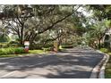 Gated community entrance with lush landscaping at 6214 Stevenson Dr # 201, Orlando, FL 32835