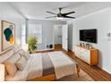 Spacious bedroom with hardwood floors and a walk-in closet at 4350 Perkinshire Ln # 111, Orlando, FL 32822